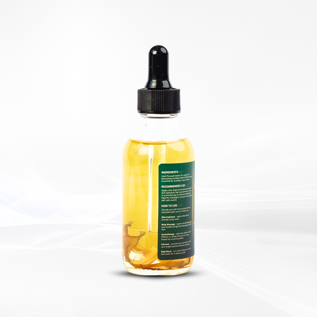 Back view of TrustBotics Blue Lotus Essential Oil bottle showing ingredients and usage instructions, highlighting golden oil with visible lotus petals.