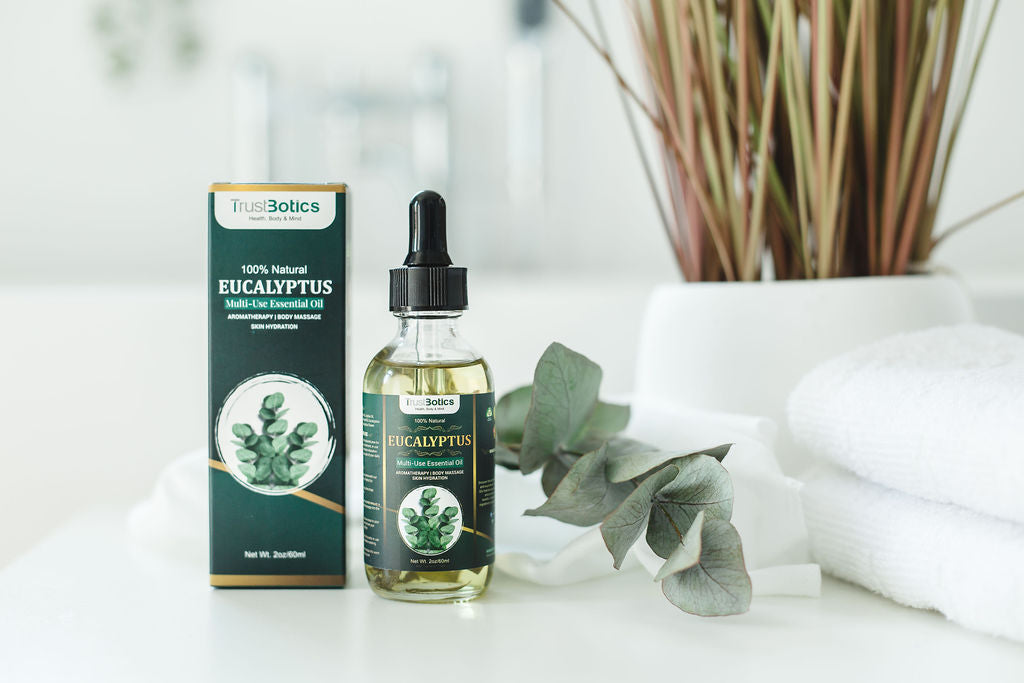 TrustBotics Eucalyptus Essential Oil with packaging, eucalyptus leaves, and spa towels, styled to highlight freshness and luxurious natural skincare.