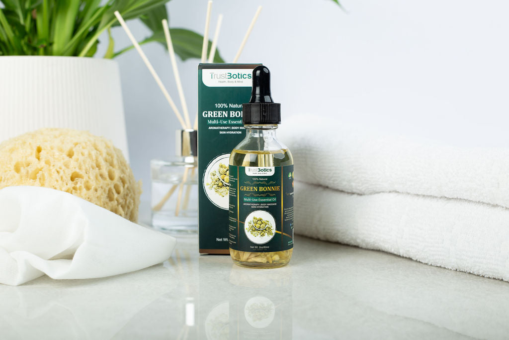 TrustBotics Green Bonnie Flower Essential Oil bottle with box – elegant spa-inspired setup featuring elderflower oil for skin and aromatherapy.
