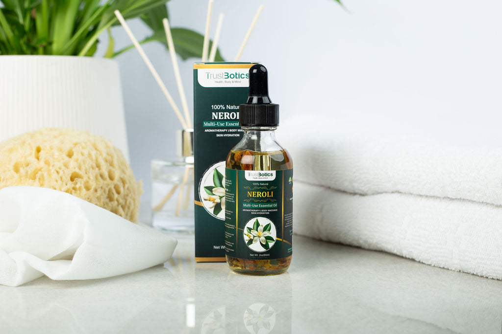 Luxury Neroli Essential Oil by TrustBotics with packaging – styled on spa background with natural decor for radiant skin and aromatherapy.