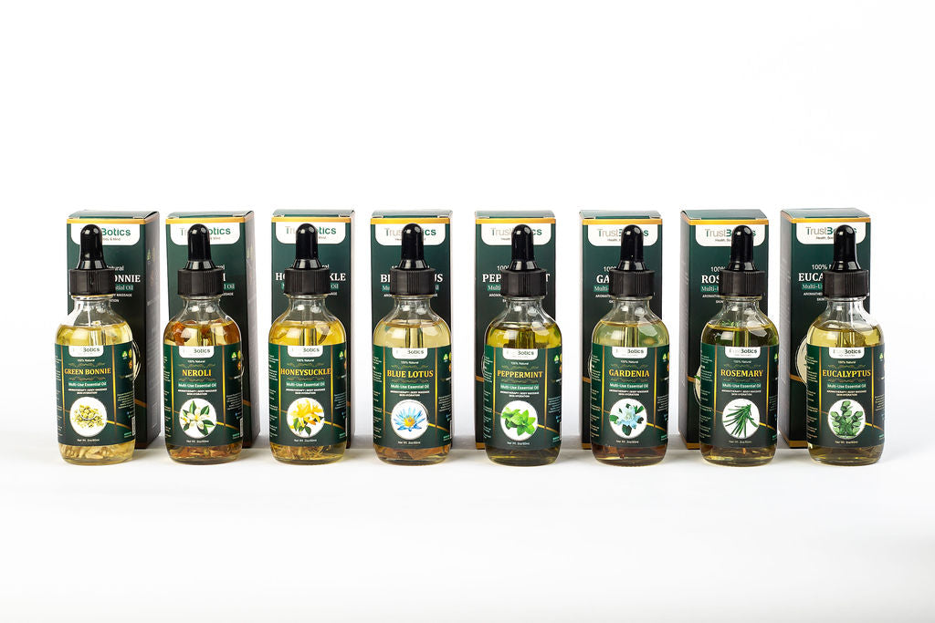 TrustBotics Signature Rituals collection featuring luxury multi-use essential oils in glass bottles, arranged together for modern self-care and daily beauty rituals.
