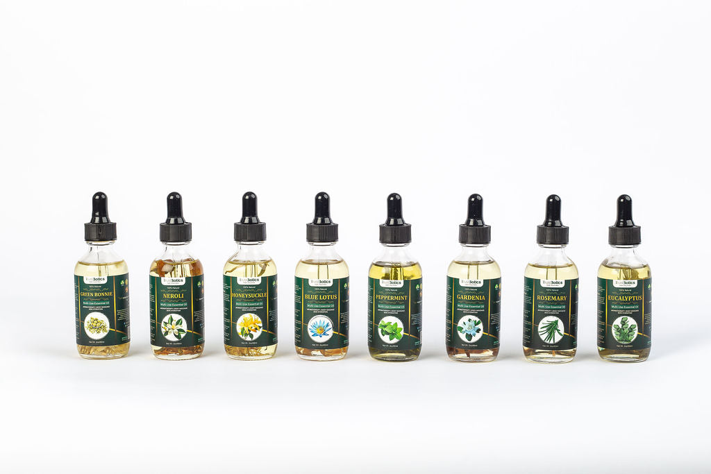 TrustBotics multi-use essential oil collection including green bonnie flower, neroli, honeysuckle, blue lotus, peppermint, gardenia, rosemary and eucalyptus aromatherapy oils for ready-to-use wellness ritual