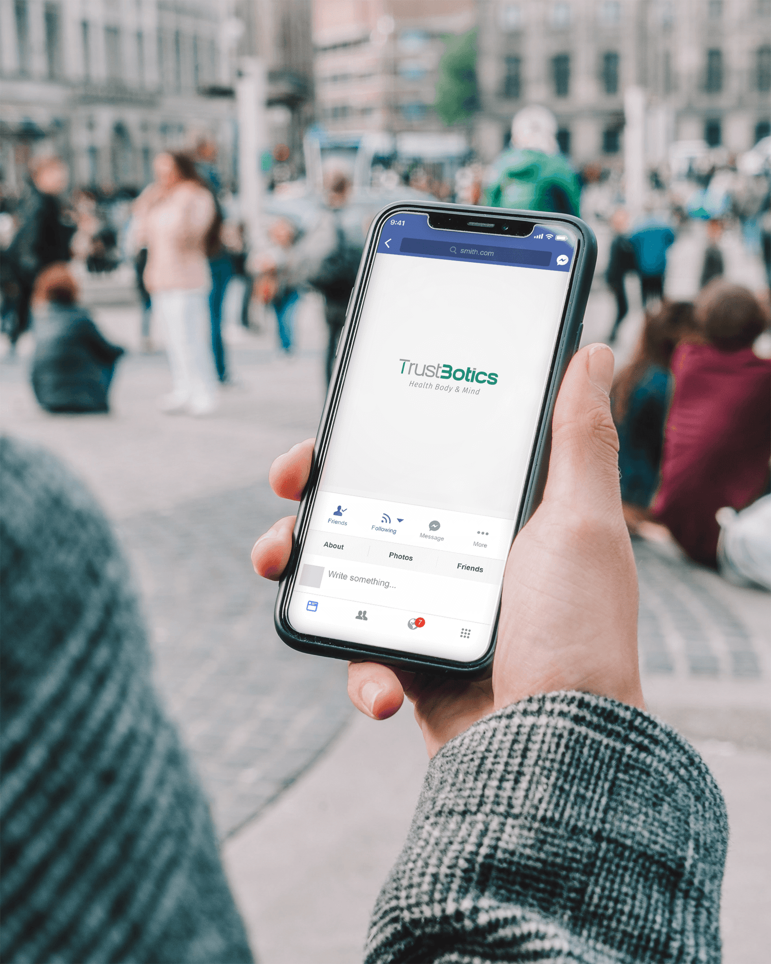 Person using smartphone showing TrustBotics wellness brand online store and natural aromatherapy lifestyle